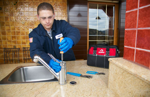 a tech is replacing a broken faucet